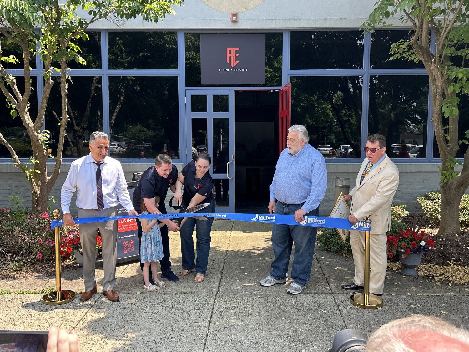 The Milford grand opening ribbon cutting