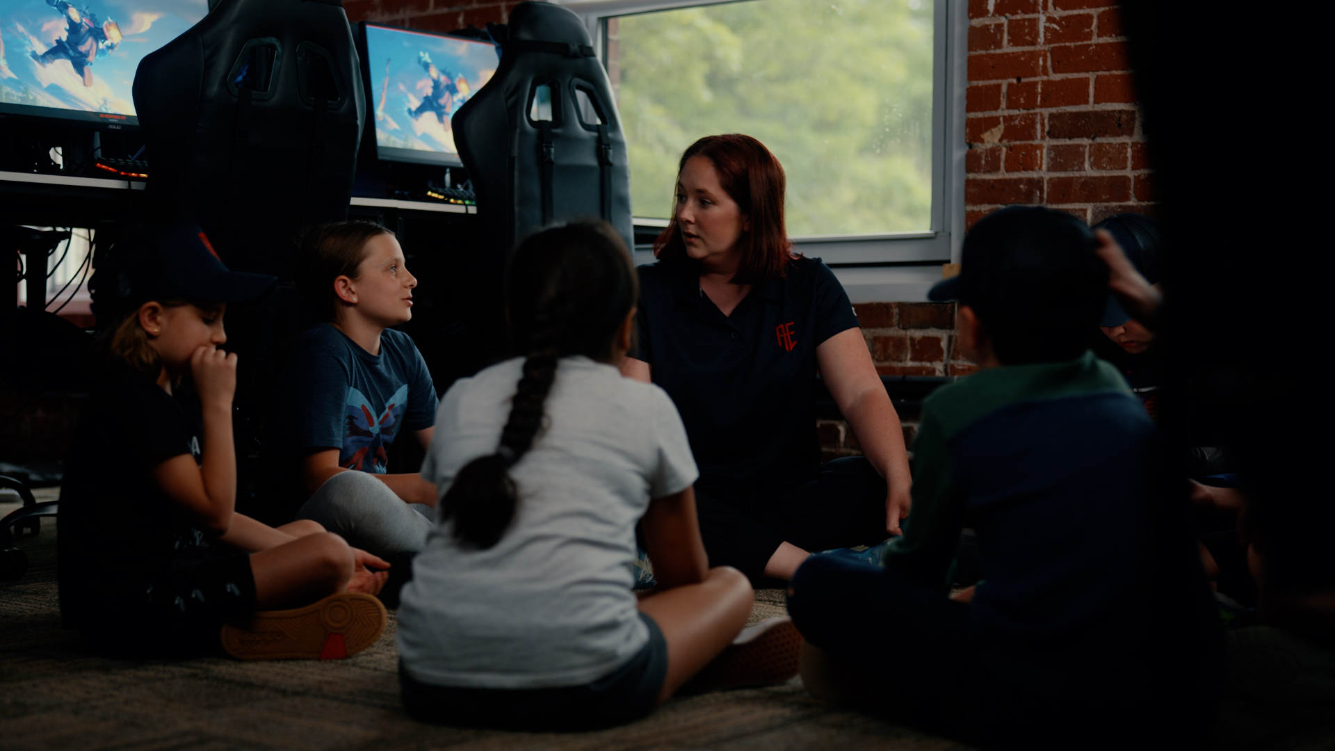 A coach with campers on the Newtown studio floor