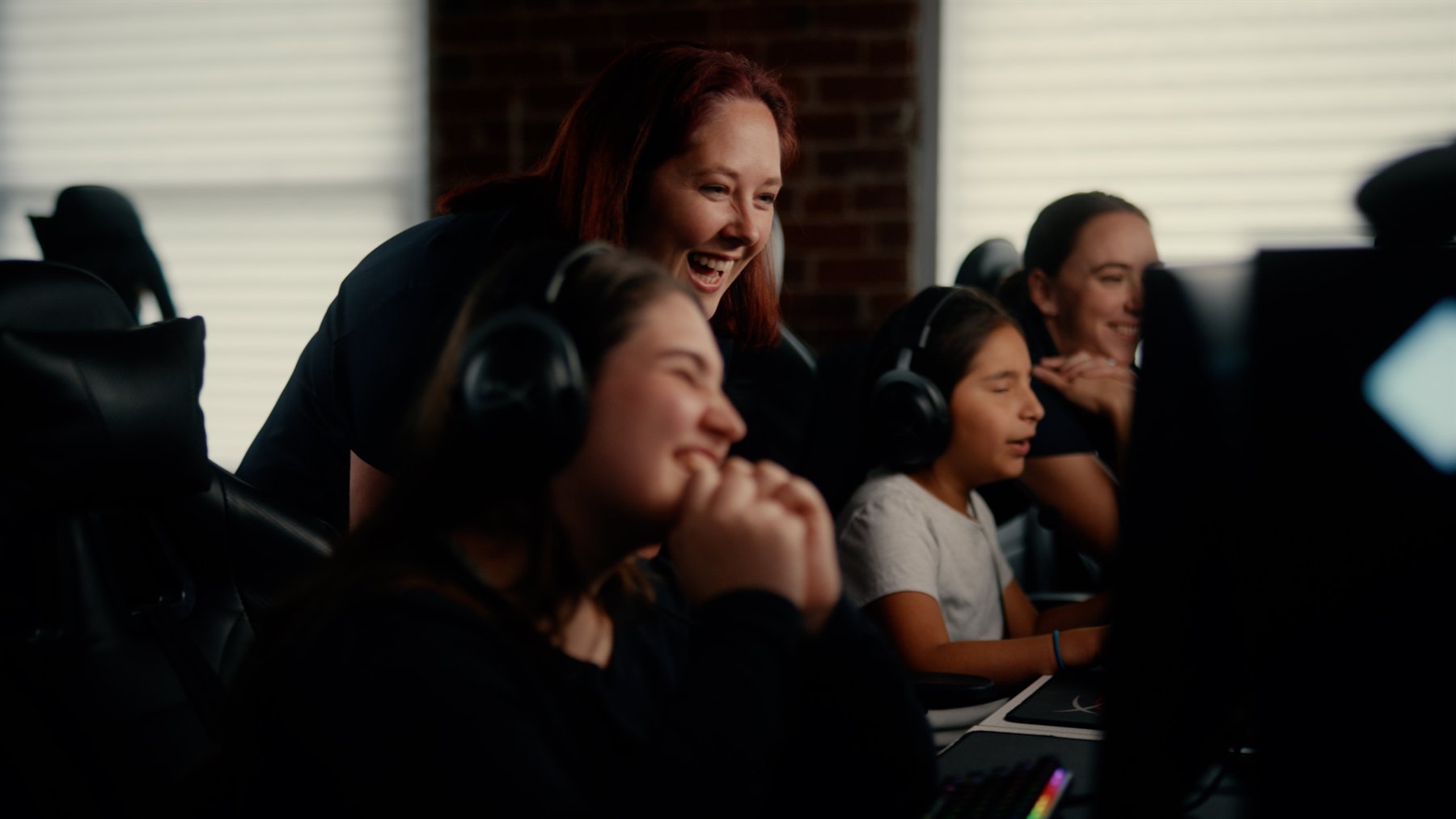 Kids laughing at gaming stations